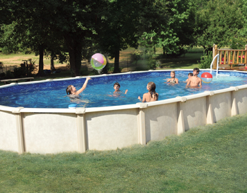 Family swimming in an above-ground pool during the summer